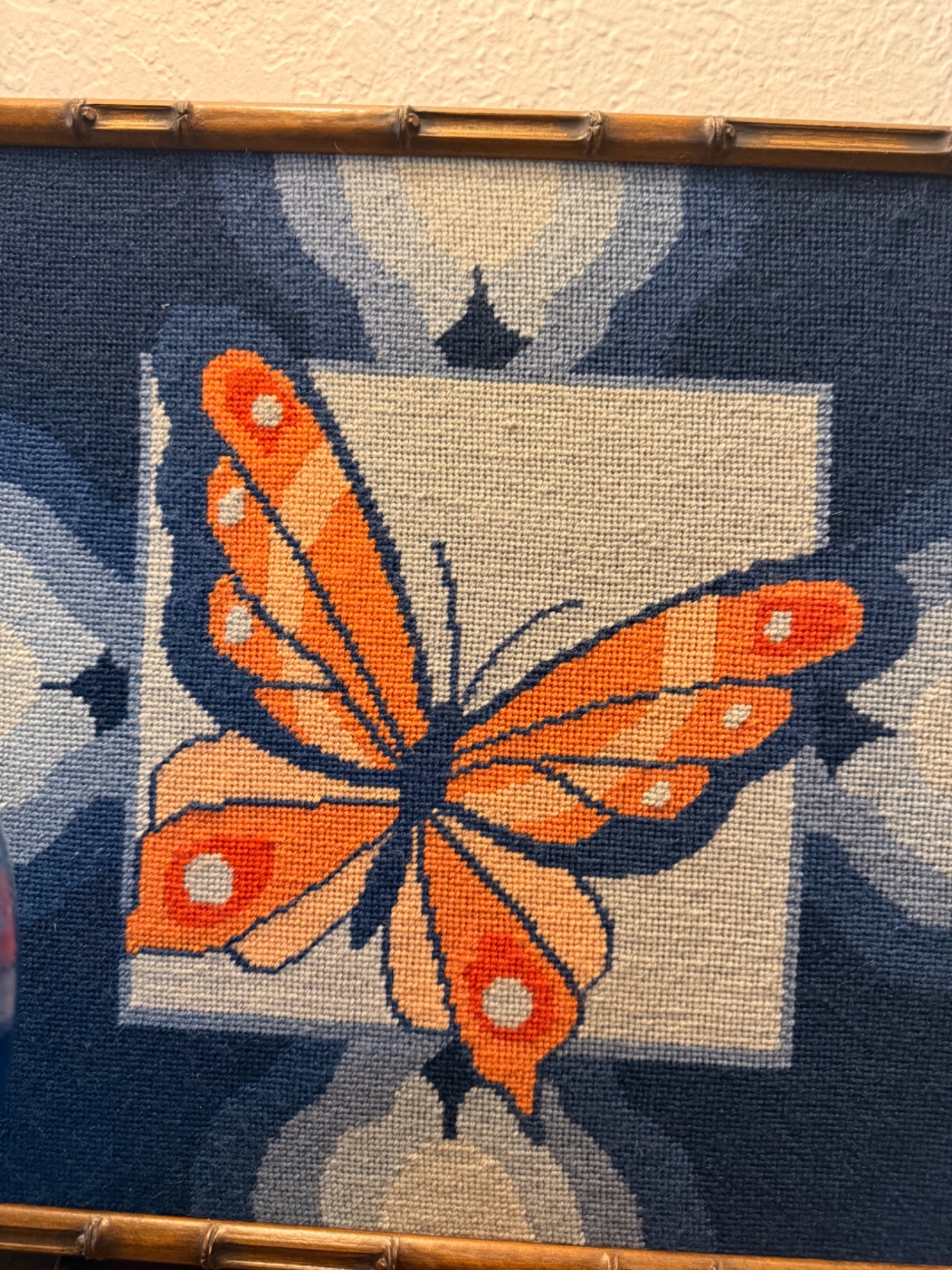 Vintage butterfly needlework in bamboo frame