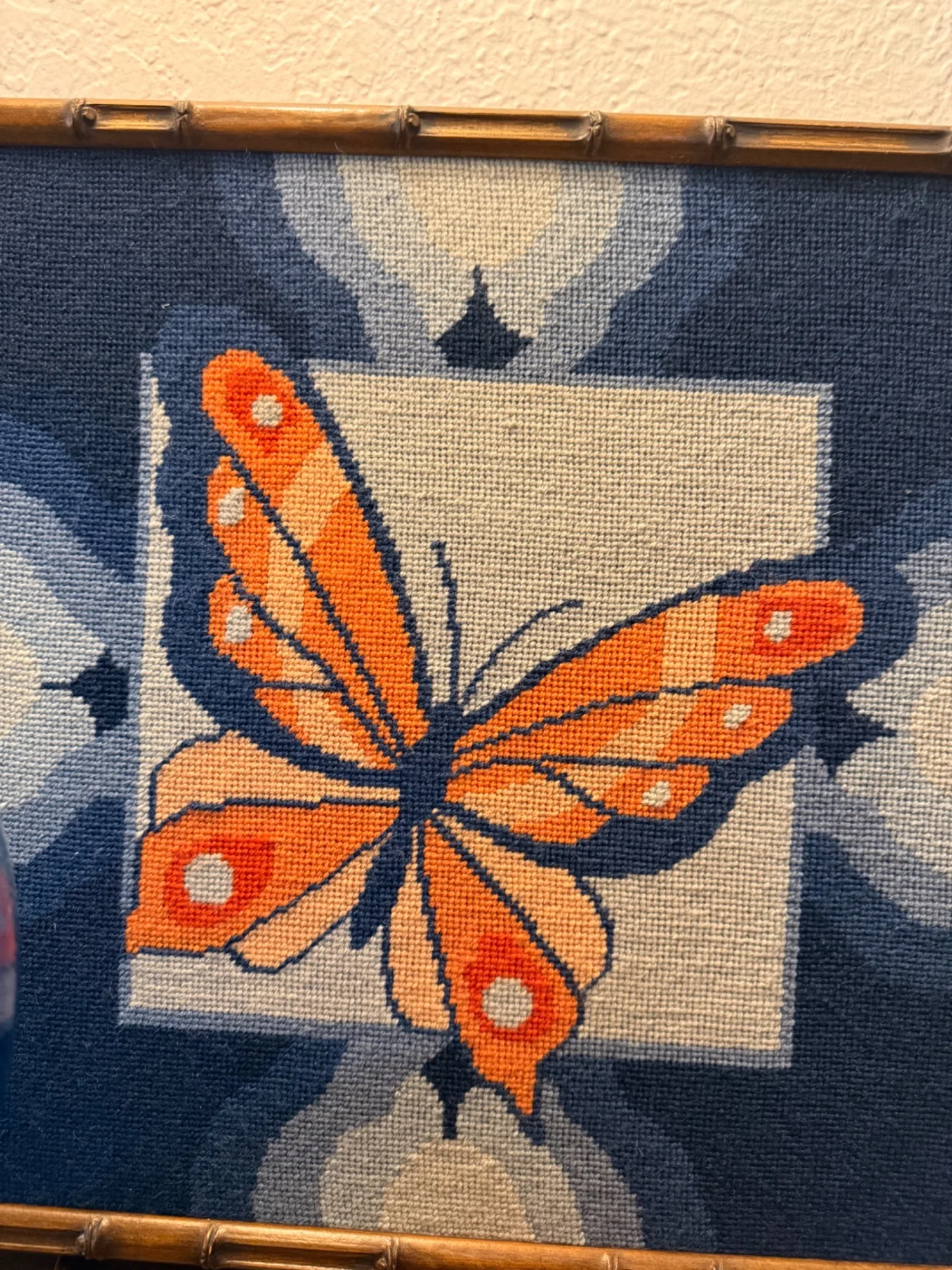 Vintage butterfly needlework in bamboo frame