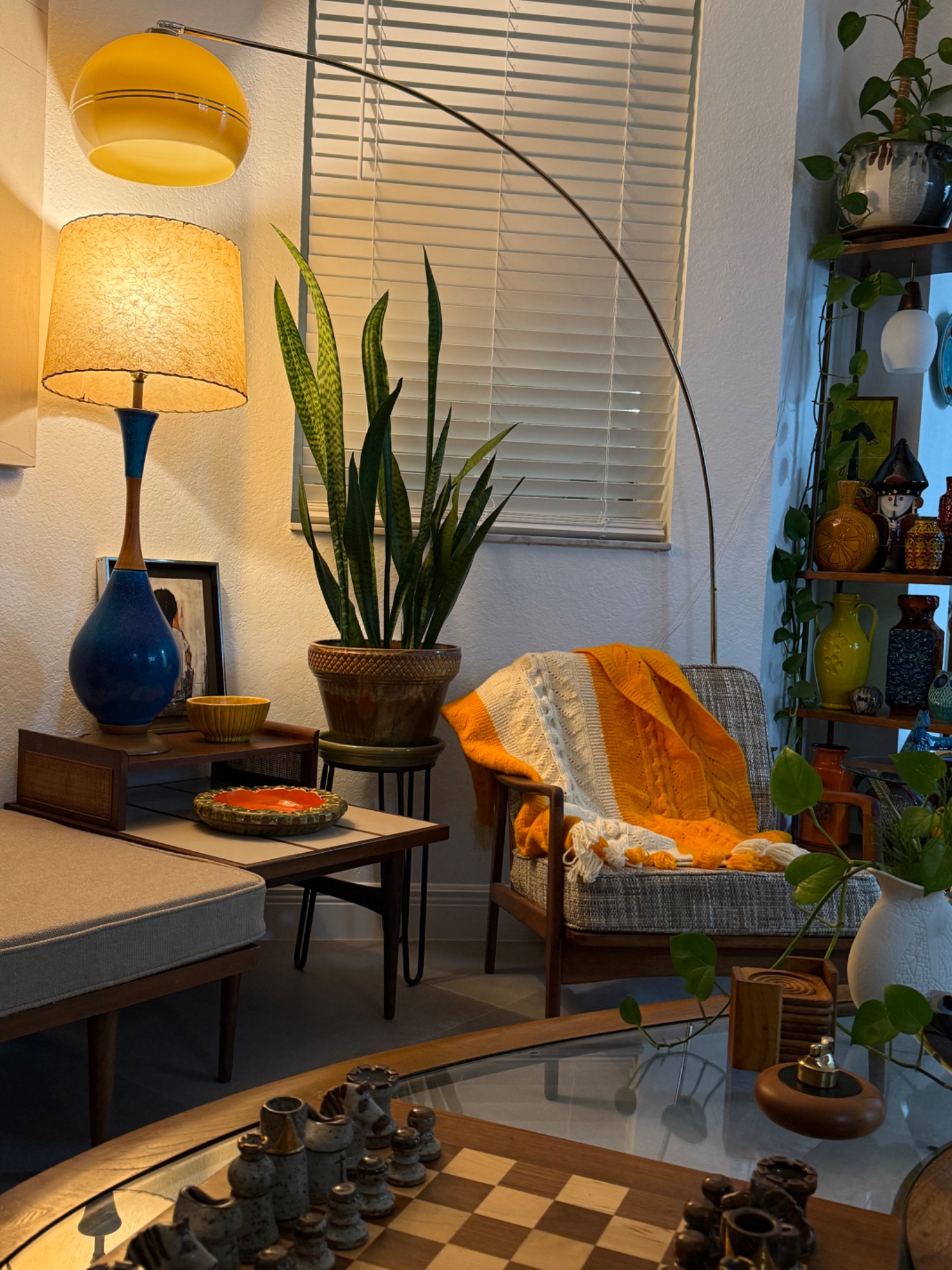Intimate vignette with green lamp and candleholders